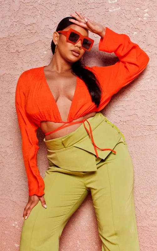 Plus Orange Linen Look Long Sleeve Plunge Beach Top sold by Pretty Little Thing