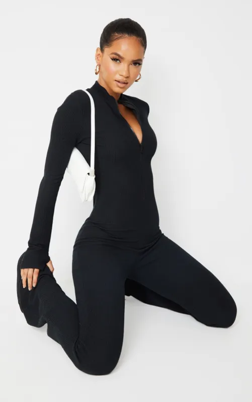 Black Thumbhole Zip Detail Rib Jumpsuit sold by Pretty Little Thing