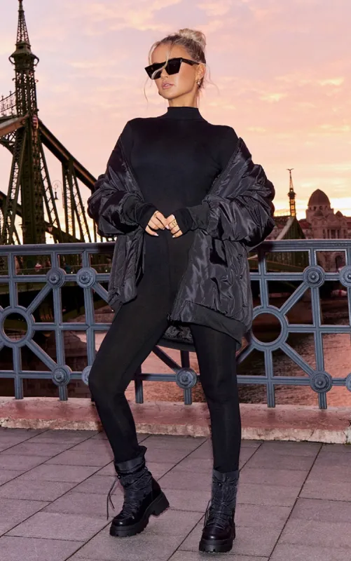 Black High Neck Thumbhole Jersey Jumpsuit sold by Pretty Little Thing