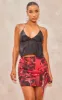 Red Floral Print Textured Chiffon Knot Front Mini Skirt sold by Pretty Little Thing