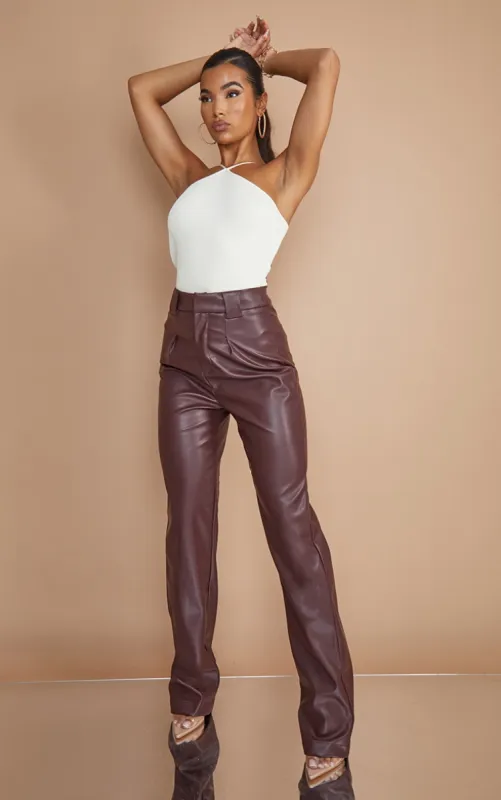 Dark Chocolate Faux Leather Dart Pocket Straight Leg Trousers sold by Pretty Little Thing
