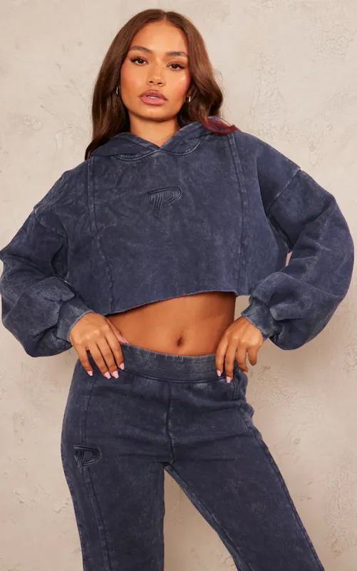 Petite Indigo Acid Wash Seam Detail Cropped Hoodie sold by Pretty Little Thing