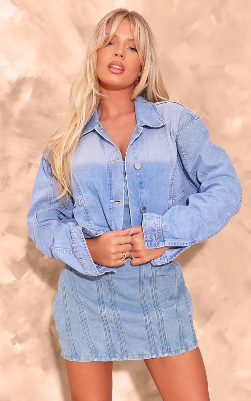 Mid Blue Wash Upside Down Waistband Crop Denim Jacket sold by Pretty Little Thing