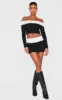 Black Faux Suede Contrast Foldover Stitch Detail Mini Skirt sold by Pretty Little Thing