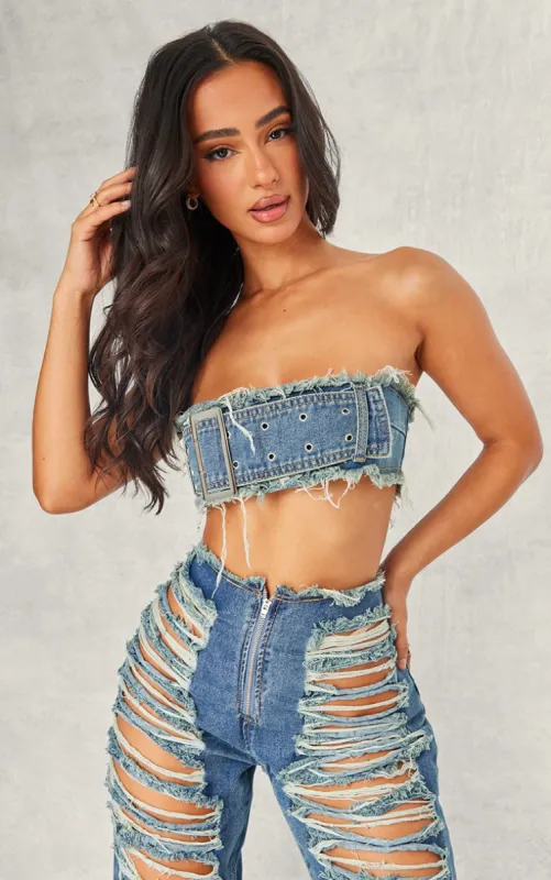 Petite Blue Denim Bandeau Belted Extreme Crop Top sold by Pretty Little Thing