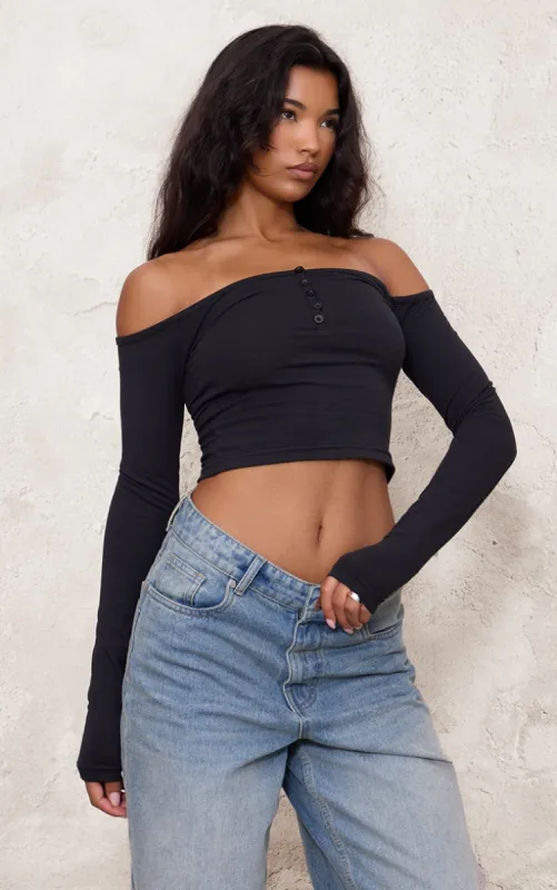 Black Bardot Button Detail Long Sleeve Top sold by Pretty Little Thing