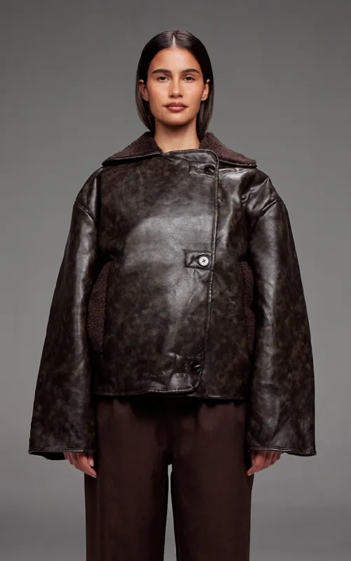 Chocolate Distressed Faux Leather Borg Contrast Aviator Jacket sold by Pretty Little Thing