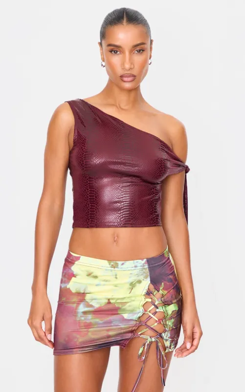 Plum Printed Lace Up Detail Slinky Jersey Low Rise Micro Mini Skirt sold by Pretty Little Thing