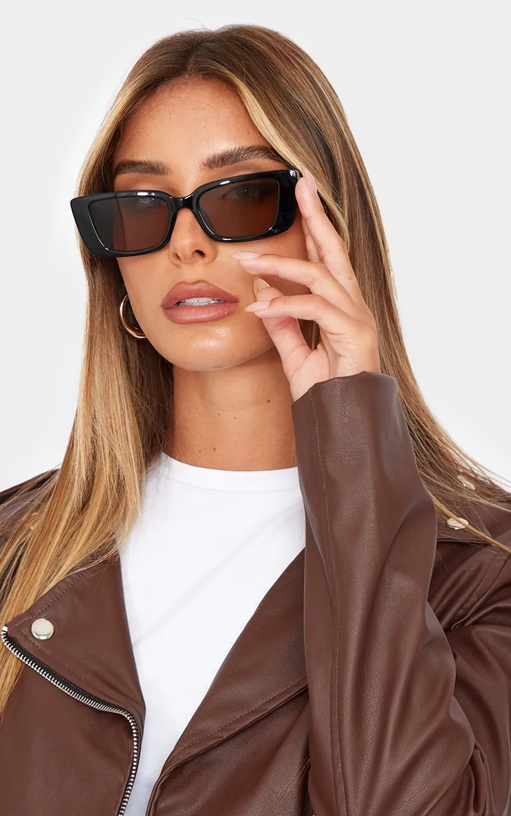 Black Tinted Lens Flared Rectangular Frame Sunglasses sold by Pretty Little Thing