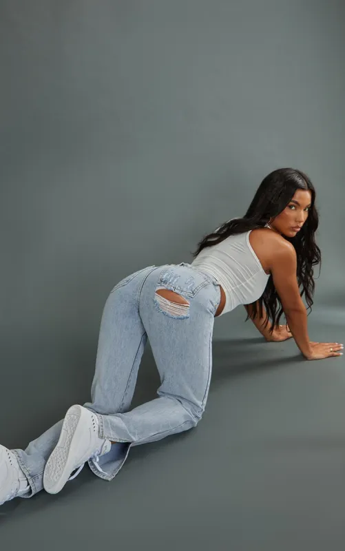 Bleach Blue Split Hem Jeans With Bum Distress sold by Pretty Little Thing