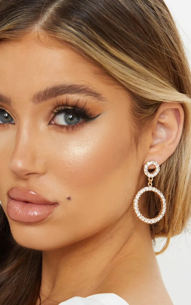 Gold Diamante Double Ring Drop Earrings sold by Pretty Little Thing
