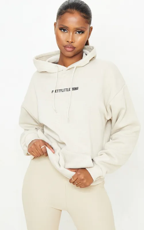 PRETTYLITTLETHING Sand Embroidered Slogan Pocket Hoodie sold by Pretty Little Thing