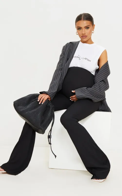 Maternity Black Ribbed Flared Leggings sold by Pretty Little Thing