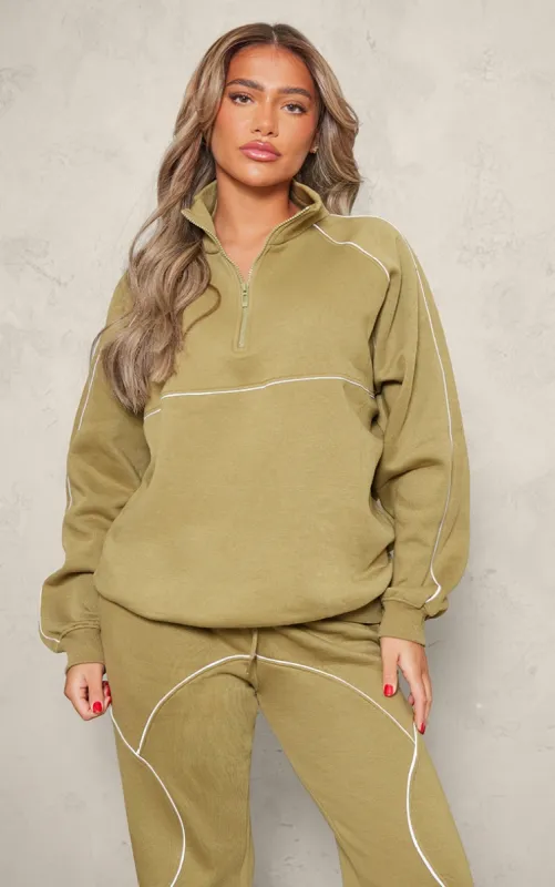 Light Olive Oversized Contrast Piping Quarter Zip Sweatshirt sold by Pretty Little Thing