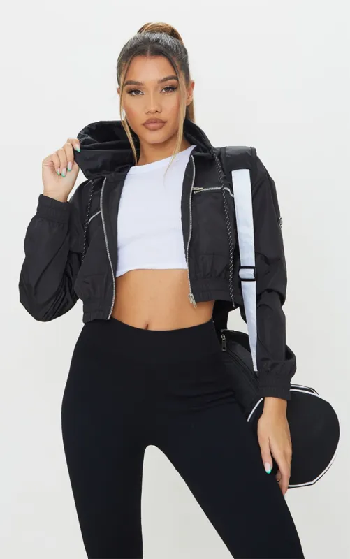 Black Nylon Shell Cropped Zip Front Jacket made by Pretty Little Thing