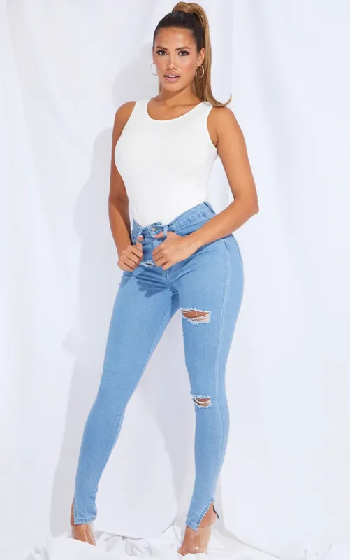 Shape Light Blue Wash Ripped Stretch Split Hem Skinny Jeans sold by Pretty Little Thing