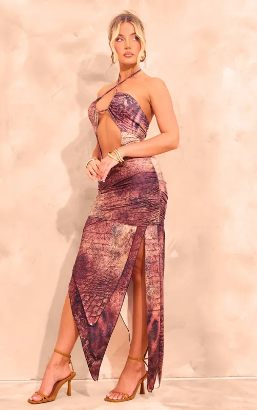 Brown Abstract Printed Slinky Halterneck Cut Out Maxi Dress sold by Pretty Little Thing