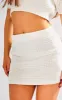 Petite Cream Boucle Mini Skirt sold by Pretty Little Thing
