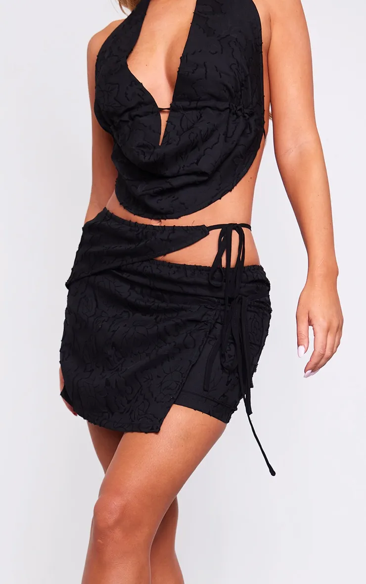 Black Floral Applique Cut Out Wrap Over Micro Mini Skirt sold by Pretty Little Thing product image thumbnail 5