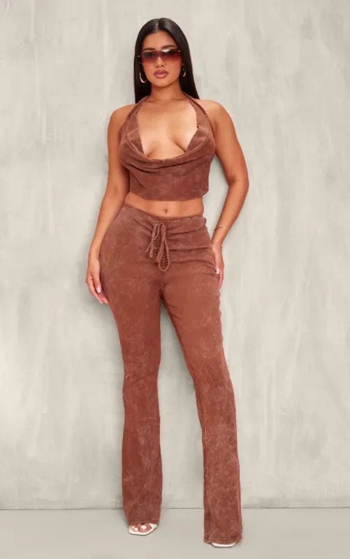 Shape Brown Washed Ribbed Ruched Front Flare Trousers sold by Pretty Little Thing