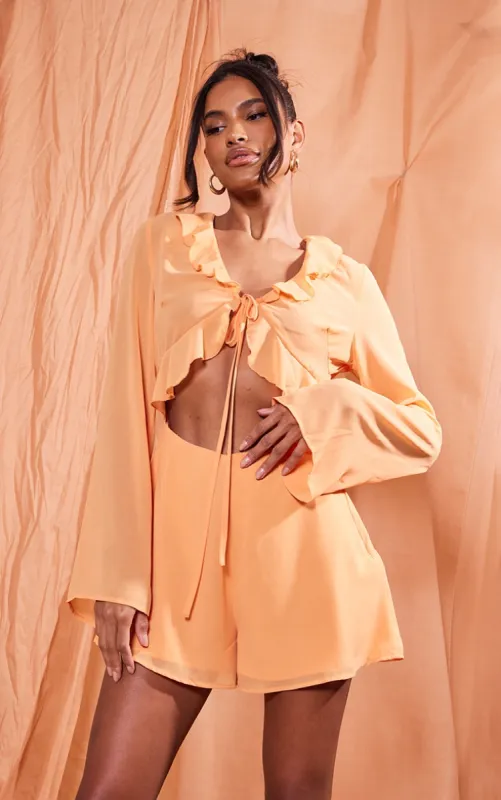 Orange Chiffon Frill Tie Bust Detail Cut Out Playsuit sold by Pretty Little Thing