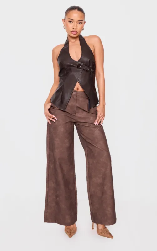 Petite Chocolate Faux Leather Wide Leg Trousers sold by Pretty Little Thing