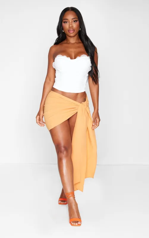 Shape Orange Crinkle Tie Mini Skirt sold by Pretty Little Thing