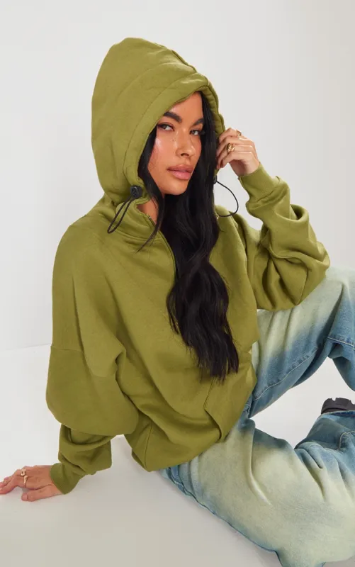 Olive Exposed Seam Half Zip Hoodie sold by Pretty Little Thing