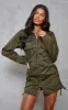 Khaki Cargo Ruched Pocket Detail Zip Through Bodycon Dress sold by Pretty Little Thing