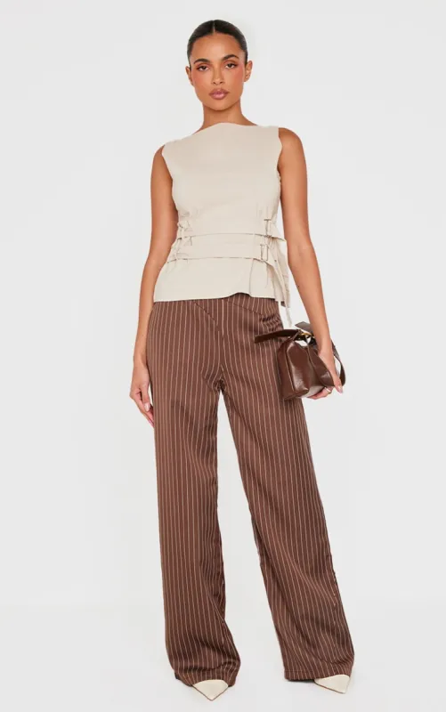 Chocolate Pinstripe Dipped Waist Straight Leg Trousers sold by Pretty Little Thing