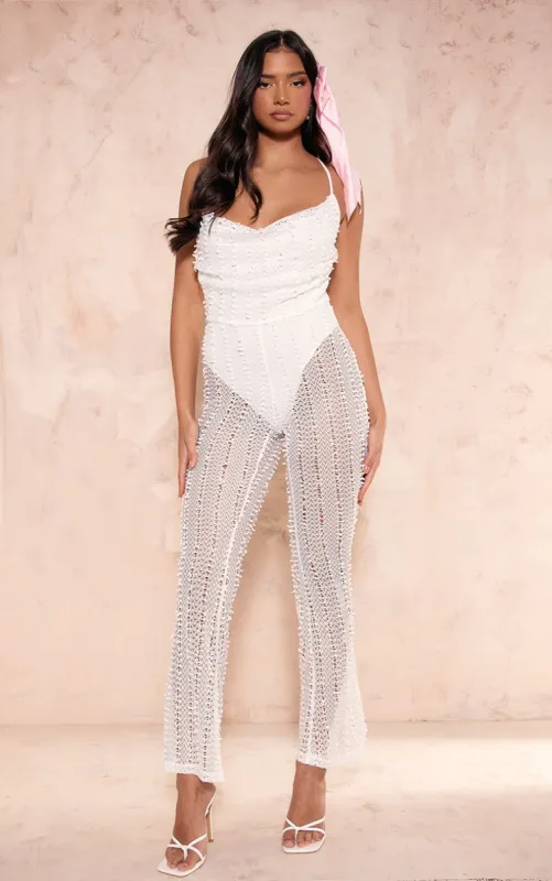 White Textured Cowl Strappy Flare Leg Jumpsuit sold by Pretty Little Thing