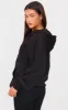 Black Oversized Zip Up Plain Front Hoodie sold by Pretty Little Thing
