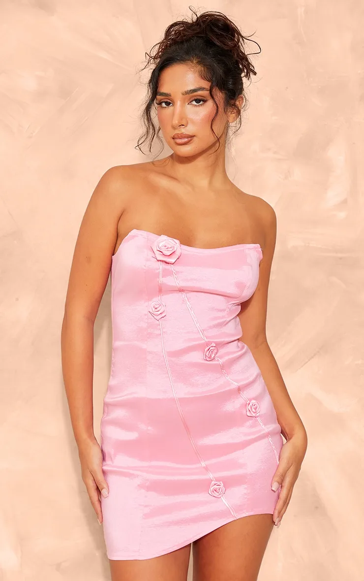 Petite Pink Woven Bandeau Structured Flower Detail Mini Dress sold by Pretty Little Thing