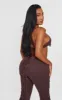 Shape Brown Denim Halterneck Lace Up Front Crop Top sold by Pretty Little Thing