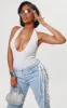Shape White Ribbed Halterneck Plunge Bodysuit sold by Pretty Little Thing