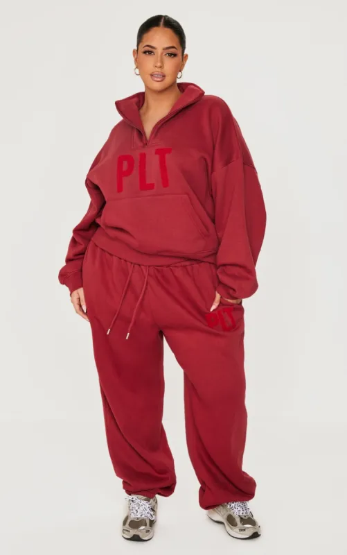PRETTYLITTLETHING Plus Dark Red Borg Applique Cuffed Joggers made by Pretty Little Thing