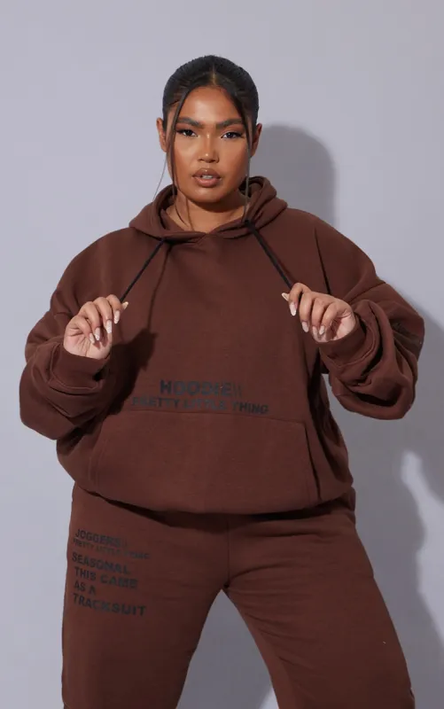 PRETTYLITTLETHING Plus Chocolate Oversized Fit Slogan Printed Hoodie sold by Pretty Little Thing