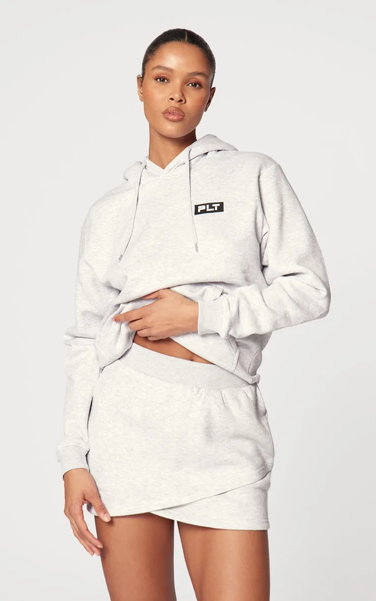 PRETTYLITTLETHING Ash Grey Logo Badge Detailed Oversized Hoodie sold by Pretty Little Thing