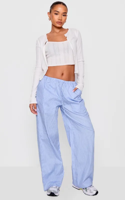 Petite Blue Pinstripe Woven Drawstring Waist Low Rise Trousers sold by Pretty Little Thing