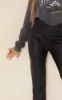 Black Faux Leather V Front Straight Leg Trousers sold by Pretty Little Thing