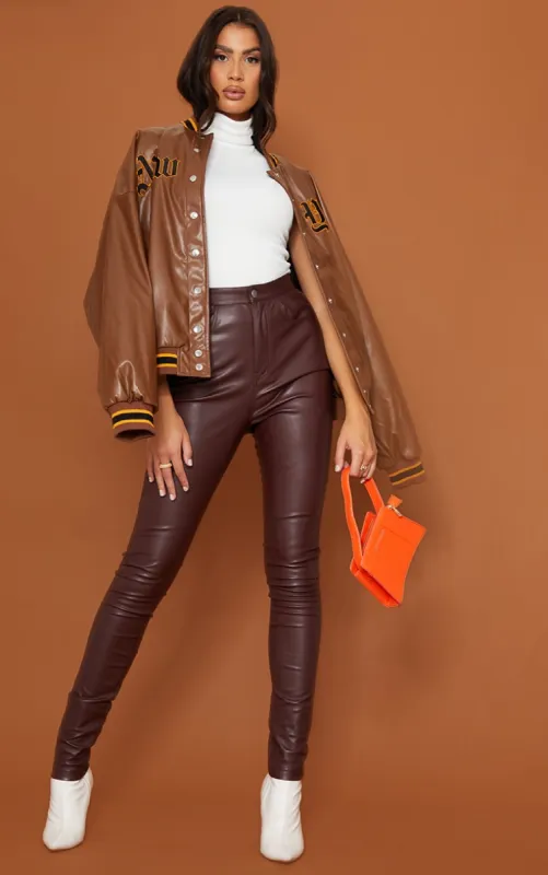 Tall Chocolate Button Up Faux Leather Skinny Trousers sold by Pretty Little Thing