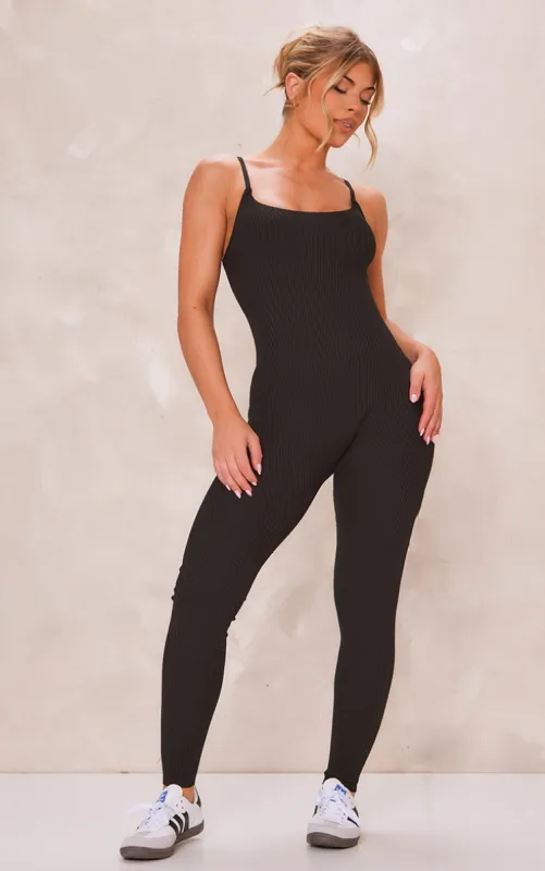 Black Ribbed Knitted Strappy Jumpsuit sold by Pretty Little Thing