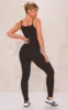 Black Ribbed Knitted Strappy Jumpsuit sold by Pretty Little Thing