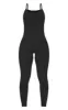 Black Ribbed Knitted Strappy Jumpsuit sold by Pretty Little Thing