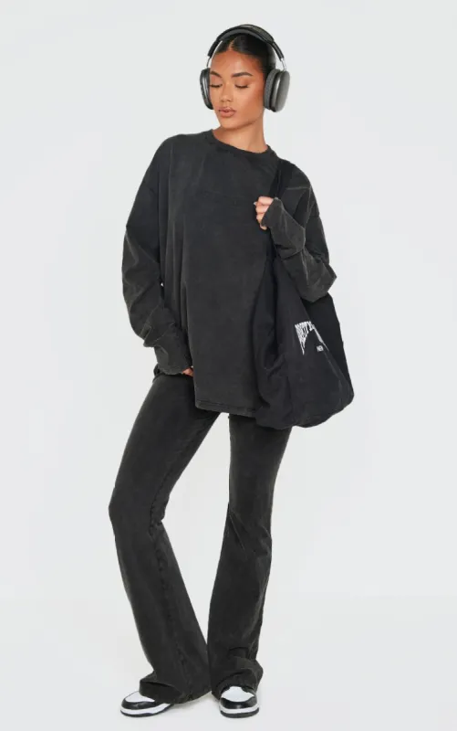 PRETTYLITTLETHING Black Embossed Logo Washed Skinny Flare Trousers sold by Pretty Little Thing