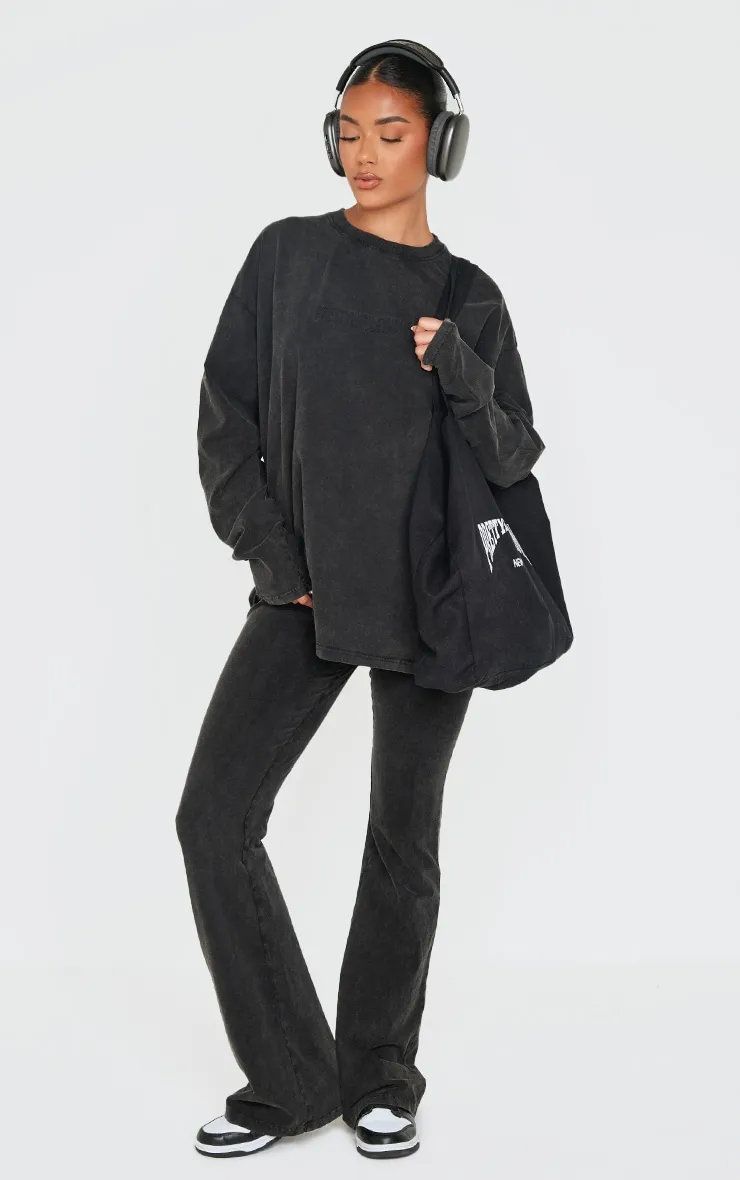 PRETTYLITTLETHING Black Embossed Logo Washed Skinny Flare Trousers sold by Pretty Little Thing