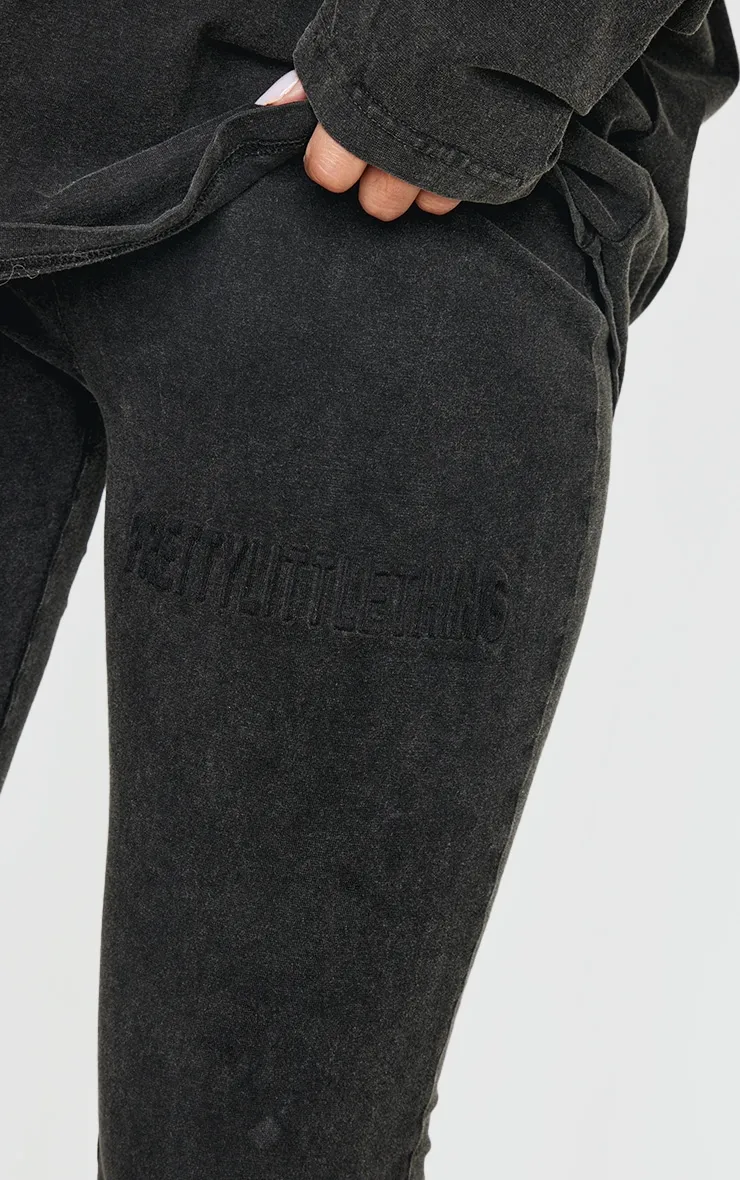 PRETTYLITTLETHING Black Embossed Logo Washed Skinny Flare Trousers sold by Pretty Little Thing product image thumbnail 4