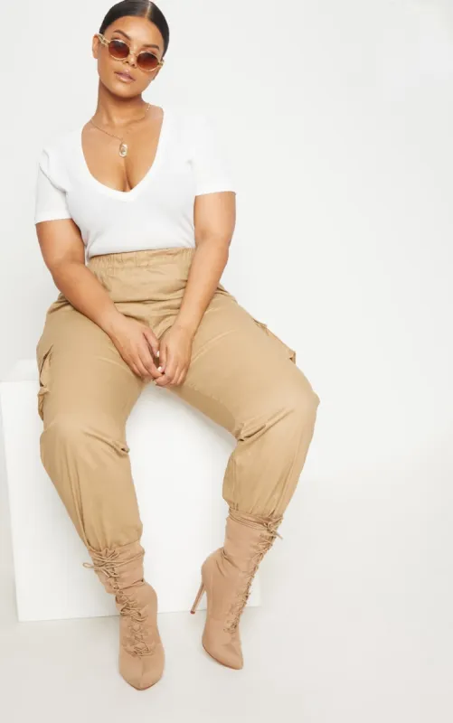 Plus White Ribbed Plunge Short Sleeve Bodysuit sold by Pretty Little Thing