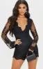 Black Lace Bell Sleeve Playsuit sold by Pretty Little Thing