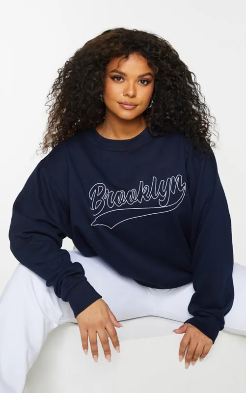 Plus Navy Brooklyn Slogan Sweatshirt sold by Pretty Little Thing